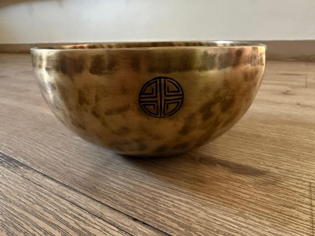 A hand-hammered AYA bowl seen from the side