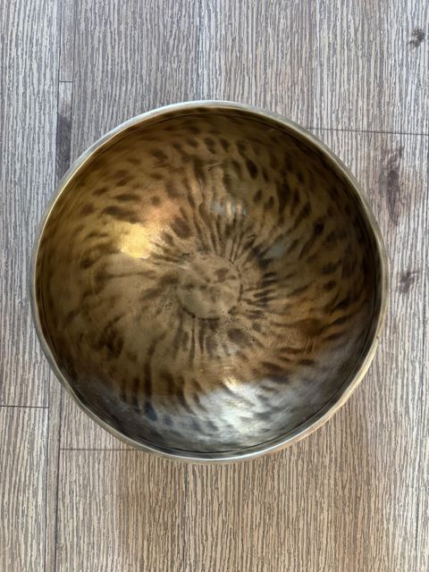 Inside an AYA bowl, hammer marks spiralling out from the centre