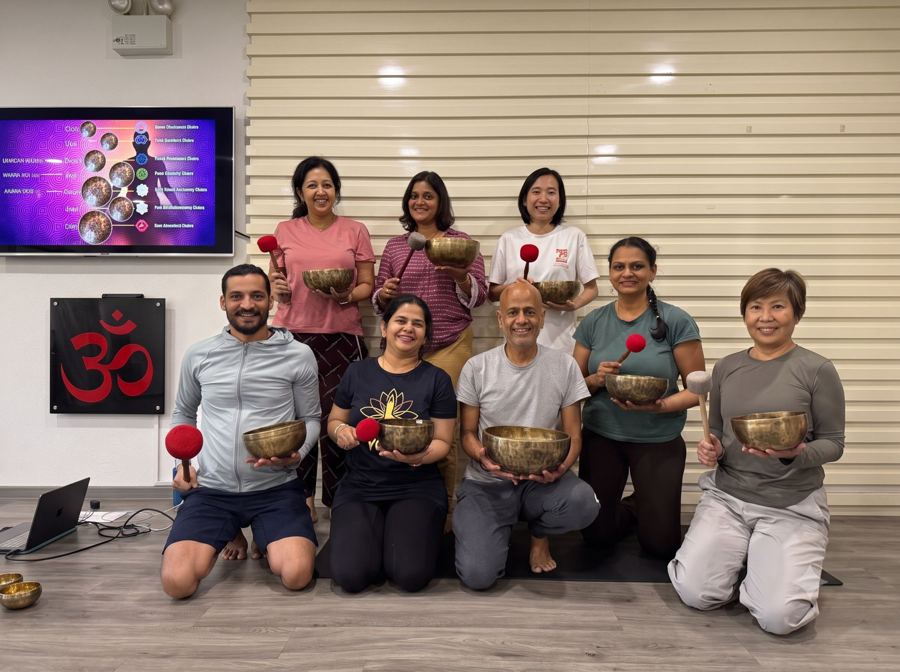 Prashant Patel with Level 1 students holding their singing bowls